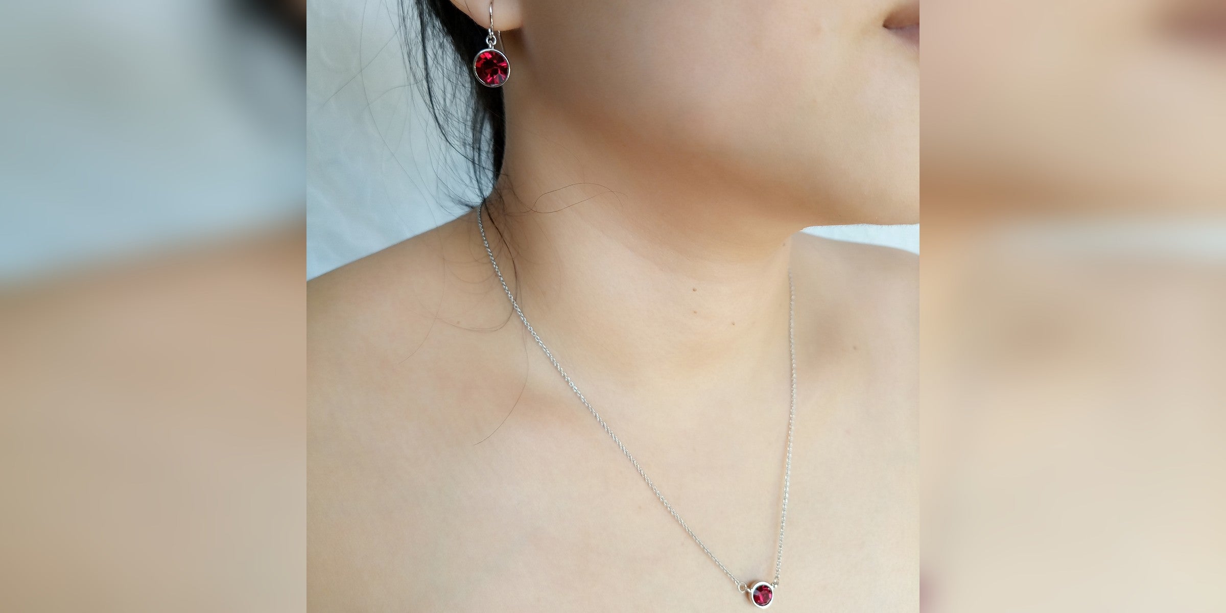 Ruby bezel necklace and earring on model