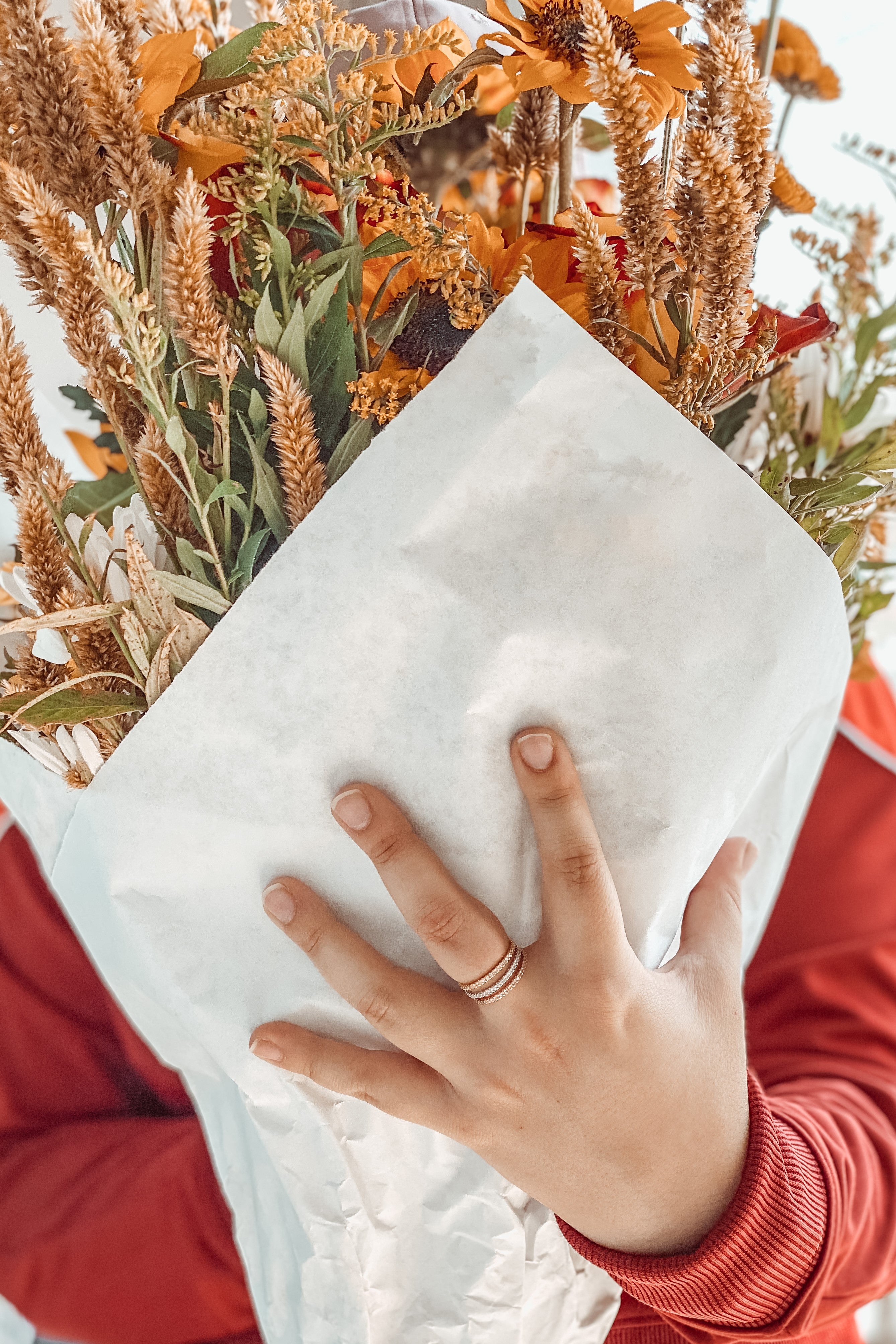 Brand values — real lifestyle, hand with rings and flowers