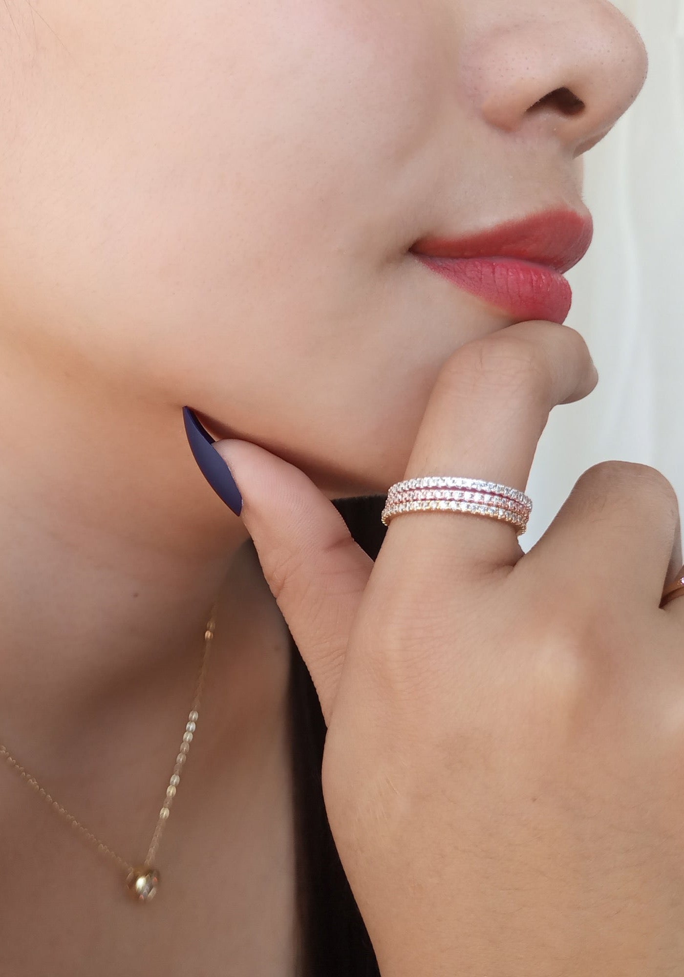 Pavé Eternity Ring - model wearing stacked rings with solitaire necklace